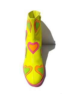 Heart To Heart Let's have a little heart to heart in these perfect NEON boots! yellow vegan leather detailed neon heart overlays yellow zipper pull fit: true to size Funky Shoes Macy's, Vivid Color Shoes, La Moda Boots Hearts, Power Puff Boots, I Love Lucy Shoes, Dopamine Dressing Shoes, Comedian Headshots, Hoedown Outfit, Toola Roola