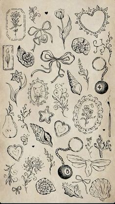 an old book with many different designs on the pages, including flowers and leaves in black ink