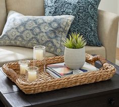 a wicker tray with candles on it