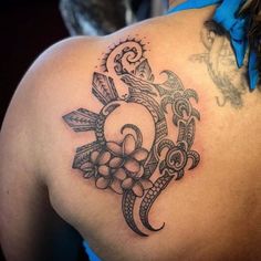 a woman with a tattoo on her back