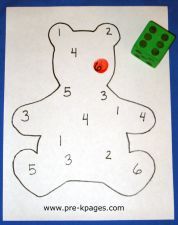 a teddy bear with numbers on it and a green dot in the middle for counting