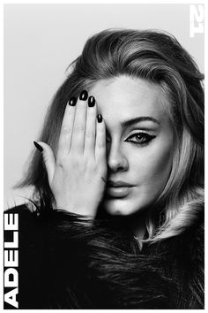 a black and white photo of a woman holding her hands to her face with one hand