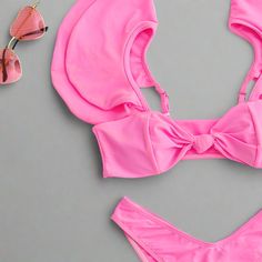 Make a vibrant splash with our Pink Flutter Sleeve Bikini Set. This eye-catching bikini features a bold pink color that’s sure to stand out at any beach or pool. The bikini top is designed with playful flutter sleeves and a secure back clasp, providing both a stylish look and a comfortable fit. The high-cut bikini bottoms offer a flattering silhouette that enhances your natural curves, making this set a perfect choice for a chic and confident beach day. Crafted from high-quality nylon, this biki Fitted Pink Swimwear With Uv Protection, Pink Ruffled Swimwear For Beach, Pink Ruffled Swimwear For Beachwear, Pink Ruffled Beachwear Swimwear, Pink Swimwear With Uv Protection, Pink Swimwear With Uv Protection For Swimming, Pink Swimwear With Uv Protection For Pool, Pink Uv Protection Swimwear For Pool, Pink Ruffled Swimwear For Vacation