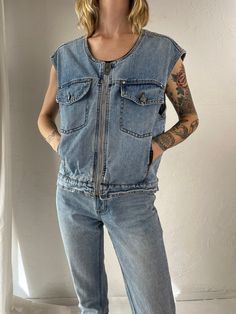 - Vintage 90s denim vest - Metal zipper up the front - Well worn in - Brand: Harley Davidson - Tagged S Chest: 20" Length: 22" We are not responsible for lost, stolen, or damaged packages once they have been shipped. Any additional customs duties or taxes incurred on international orders are the responsibility of the buyer. Please note that our items are vintage and may have minor flaws or imperfections due to their age, which adds to their unique character. Spring Utility Denim Sleeveless Vest, Spring Utility Sleeveless Denim Vest, Spring Sleeveless Utility Denim Vest, Trendy Spring Vest With Zipper Closure, Denim Vest For Everyday Spring Wear, Spring Denim Vest For Everyday Wear, Denim Vest For Spring Streetwear, Grunge Denim Vest For Streetwear, Casual Spring Vest With Zipper Closure