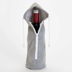 a bottle of wine in a grey hoodie with white zippers on the side