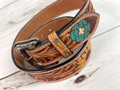 Leather Western style belt with removable buckle. Belt Sizes 1.75” wide Small 29”-32” Medium 32”-36” Large 36”-40” XL 40”-44” (buckle is removable with screws) handmade and painted leather tooled and painted by American Darling Not customizable Western Leather Belt, Tack Sets, Western Leather, Painting Leather, Saddle Pads, Purse Strap, Wild Flower, Buckle Belt, Leather Tooling