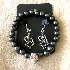 Halloween Skeleton Earrings & Bracelet Set. Full Body Skeleton Earrings With Matching Gun Metal Beaded Bracelet With Rhinestone Skull Head. Get Halloween Ready With This Spooky Set. Punk Skull Jewelry For Halloween, Punk Alloy Jewelry For Halloween, Punk Style Skull Jewelry For Halloween, Punk Stainless Steel Jewelry For Party, Edgy Silver Alloy Jewelry, Punk Style Stainless Steel Jewelry For Party, Punk Style Stainless Steel Party Jewelry, Edgy Jewelry For Halloween Gift, Edgy Sterling Silver Jewelry For Halloween