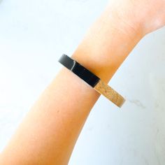 Wood and black contrast bangle bracelet Adjustable Black Cuff Bracelet With Strap, Adjustable Black Band Cuff Bracelet For Everyday, Modern Black Enamel Bangle Bracelet, Adjustable Black Wristlet With Bracelet Strap, Elegant Black Wristlet For Gift, Adjustable Black Cuff Bracelet, Black Adjustable Cuff Wristband, Modern Black Bracelets For Everyday, Adjustable Cuff Black Wristband