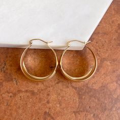 14KT yellow gold wide + chunky, tapered hoop earrings. Medium size round hoops with yummy chunkiness to make a statement. Length: 27mm Width: 24mm Thickness: 10.5mm (at widest point) Tapers Weight: 3.50 grams Stamped 14K Wire + clutch backs Hoop Earrings Medium, Saint Jewelry, Perfect Love, Fabric Ribbon, Gold Hoop, Gold Hoop Earrings, Beautiful Earrings, Medium Size, Jewelry Collection