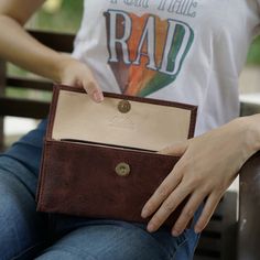 With so many ladies' wallets on the market, it's difficult to decide which one best fits your needs. We are here to help and believe we have some great options to consider. Our Handmade Brown Women’s Wallet is a comfortable way to carry your necessities. There are two bill compartments, 12 storage slots for cards and two open space compartments. The interior zipper pocket is perfect for those small items and loose change. Everything closes easily with a magnetic closure. Beyond its great appeara Rectangular Everyday Clutch, Everyday Rectangular Trifold Wallet With Snap Closure, Brown Wallets With Snap Closure For Everyday Use, Brown Wallet With Snap Closure For Everyday Use, Rectangular Wallets With Interior Card Slots For Everyday Use, Travel Bifold Coin Purse With Snap Closure, Bifold Coin Purse With Snap Closure As Gift, Bifold Clutch With Coin Pocket For Everyday, Everyday Bifold Clutch With Coin Pocket