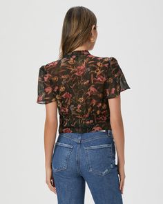 This feminine blouse is designed with short flutter sleeves, covered buttons, a skinny neck tie, angled bust details, and a cropped, streamlined silhouette. Ayla is crafted from 100% silk georgette with a crinkle texture and comes in a chic black poppy floral print. | Ayla Blouse - Black Multi Silk | Size 6 Black Poppy, Feminine Blouses, Blouse Black, Flutter Sleeves, Covered Buttons, Black Blouse, Flutter Sleeve, Tunics, Neck Tie