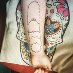 a person with a tattoo on their arm