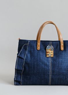 Denim handbag,  Denim jean tote bag  * Brooch pin is not included * Patterned Straps: https://www.etsy.com/shop/Bokzim?ref=shop-header-name&listing_id=1483467417&from_page=listing&search_query=patterned+strap 👉 F E A T U R E S - Extremely light!! (450g) - A 13" laptop fits in - ONE inner pocket and ONE outer pocket - Adjustable denim shoulder/crossbody strap included - Comfortable grip  - Bag bottom shaper  [Light weight]: Free your hands from burdens! Considering its size, this bag is extremel Jean Tote Bag, Bag Brooch, Denim Handbag, Denim Shoulder Bag, Longchamp Bag, Wedding Bags, Denim Handbags, Denim Purse, Denim Shoulder Bags