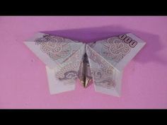 an origami butterfly made out of money on a pink background with the words $ 500 written below it