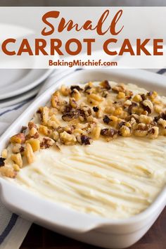 a white casserole dish filled with carrot cake