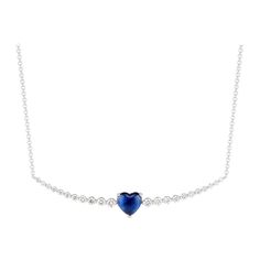 Appearing to float along a strand of diamonds, a vivid blue, heart-shaped sapphire makes an impactful impression in Ri Noor’s Floating Ruby Heart and Diamond Necklace. Round diamonds increase in size towards the central element of the necklace, creating a design that is subtle yet elegant, dazzling yet approachable. The slightly curved horizontal bar is suspended on a simple chain, all set in 18k white gold. Blue Diamond Necklace, Bone Bead Necklace, Ruby Heart, Diamond Heart Pendant Necklace, Simple Chain, Heart Necklace Diamond, Gold Rings Fashion, Rings Fashion, Sapphire Pendant