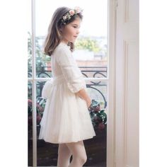 An ideal style for the coming ceremony and party season. Stunning white dress in a rich cotton/linen blend finished by the most delicate and sophisticated looking plummets tulle. Elegant 3/4 sleeves with delicate plummets mini ruffle around the edge of the collar and the sleeves. The statement sash is also made of the same tulle giving the dress a very special touch and look. Absolutely stunning when paired with our party off-white Mary Jane shoes. Please allow 4 weeks between order and delivery Spring First Communion Tulle Dress, Elegant Long Sleeve Baptism Dress For Formal Occasions, Elegant Cream Dress With Tulle Skirt, White Tulle Skirt Dress For First Communion, White Tulle Dress For First Communion, Elegant Spring Baptism Dress, Elegant Long Sleeve Confirmation Dress, Elegant Fitted Baptism Dress With Tulle Skirt, Elegant Tulle Skirt Dress For Confirmation