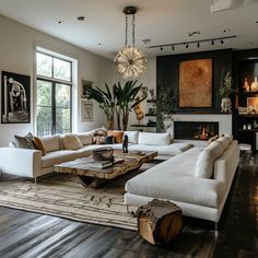 a living room filled with lots of furniture and a fire place in the middle of it