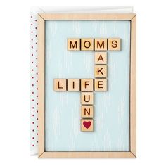 a wooden crossword puzzle with the words mom's ak life fun