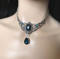 This elegantly ornate necklace is made with antique silver tone centerpieces, featuring lavish baroque details. Its mesmerizing design is accented with dazzling dark teal glass crystals/jewels. Decorated portion is 4" wide and 2 1/2" tall in the very center.  Necklace length is adjustable 14"-17" with soldered stainless steel cable chain, lobster clasp and extender.If you would like a different length, please send us a message.Earrings: These dainty and elegantly ornate earrings are made with an Baroque Details, Ornate Earrings, Gothic Antique, Ornate Necklace, Teal Jewelry, Dnd Items, Beaded Bib Necklace, Aqua Glass, Victorian Wedding