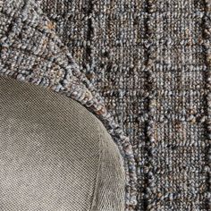 an up close view of the texture of a carpet with different colors and patterns on it