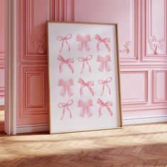 a pink room with an art piece on the floor and wall in front of it