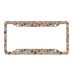 a license plate frame with flowers on it