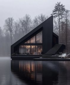 a house that is on the water with stairs leading up to it's roof