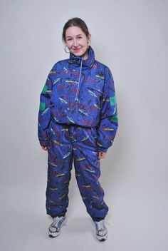 "Vintage one piece blue ski suit, retro funny print snow suit, Size L Welcome to TARASCOMMON.ETSY.COM Unique clothing from the 20th century. Model tall - 170cm Size: L. Sleeve - 50cm / 19.68inch ( armpit to end of sleeve); Width - 49cm / 19.29inch; Length - 158cm / 62.2inch; Hips - 54cm / 21.25inc; Shoulder to front crotch - 86cm / 33.85inch. All measurements are taken seam to seam while lying flat. Polyester/ Nylon. This item is vintage, so it can have some defects. Additional photos can be sen 90s One Piece, Vintage One Piece, Winter Jumpsuit, Retro Funny, Sport Shirts, Vintage Clothing Stores, Ski Suit, Retro Humor, Ski Suits