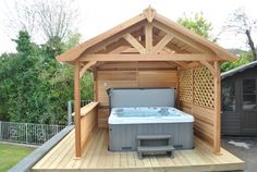 a hot tub sitting on top of a wooden deck