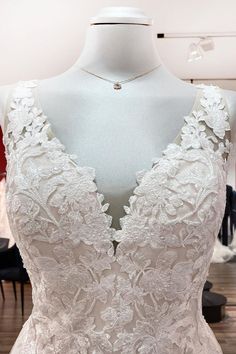 a wedding dress on display at a bridal shop