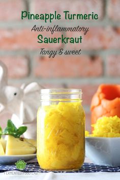 pineapple turment and sauerkraut in a mason jar on a table