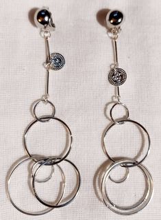 Nice light style These hang 4 inches large size Silver metal clip on Multi hoop style These are very lightweight on the ear Handmade originals Only 1 available Easy to wear Statement style They are one of a kind These Earrings are a classic and timeless addition to any wardrobe Everyday Metal Hoop Clip-on Earrings, Metal Small Hoop Clip-on Earrings, Trendy Adjustable Metal Clip-on Earrings, Trendy Clip-on Dangle Hoop Earrings, Everyday Metal Clip-on Earrings, Everyday Round Metal Clip-on Earrings, Everyday Hoop Clip-on Earrings, Trendy Dangle Clip-on Hoop Earrings, Modern Clip-on Dangle Hoop Earrings