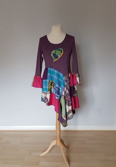 "One of a kind upcycled tunic dress made from upcycled clothing and colourful fabrics. Top part is soft and stretchy. Asymmetrical bottom. Can be worn with jeans, leggings or as a dress.  Size M -L Measurements bust - 37\" and stretches to 42\" length - 32-44\" Wash by hand or in washing machine in 30 degrees on wrong side. There is a lot of outstanding designs in different sizes in my shop www.etsy.com/uk/shop/BosaHandmade?ref=hdr_shop_menu Please like my FACEBOOK website to be up to date with Womens Tunic Dress, Facebook Website, Tunics With Leggings, Upcycled Dress, Bohemian Dresses, Unique Clothes For Women, Dress Unique, Curvy Women Outfits, Upcycled Clothing