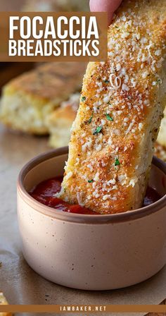 Close-up of a breadstick garnished with parmesan cheese and parsley being dipped into a cup of marinara sauce. Pizza Hut Breadsticks, Breadsticks Easy, Easy Focaccia, Homemade Focaccia Bread, Homemade Breadsticks, Homemade Focaccia, Bread Sticks Recipe, I Am Baker, Olive Oil Garlic