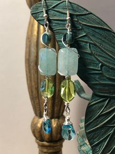 Tangle drop earrings aquamarine gemstone crystal and glass beads wire wrapped in plated sterling silver wire. Aquamarine Jewelry, Aquamarine Gemstone, Beads And Wire, Silver Wire, Boho Jewelry, Aquamarine, Wire Wrapped, Turquoise Necklace, Jewelry Earrings Dangle