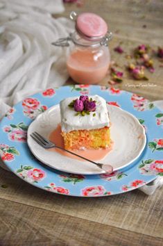 a piece of cake sitting on top of a plate next to a jar of liquid