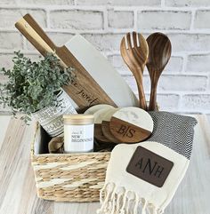 a basket filled with wooden spoons and utensils on top of a table