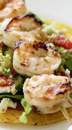 a close up of a plate of food with shrimp