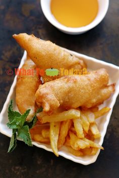 fried fish and french fries with dipping sauce