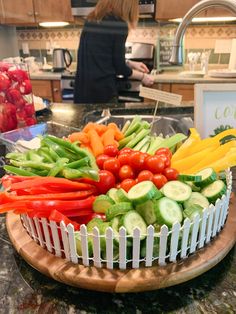 a platter full of vegetables on a kitchen counter