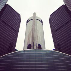 looking up at two skyscrapers from the ground