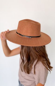 This wool wide brim hat with two interchangeable belts is the perfect addition to your wardrobe. Crafted from a wool blend, this stylish and timeless hat will elevate your look and give you a distinguished flair. Included with each hat are two belt color options: brown or black 10% wool, 90% polyester Chic Adjustable Brown Fedora, Chic Brown Winter Hats, Chic Brown Felt Hat For Winter, Brown Fall Hat Bands, Adjustable Brown Fedora For Fall, Brown Wide Brim Felt Hat For Fall, Chic Brown Hat For Fall, Chic Brown Fall Hat, Adjustable Brown Hat Bands For Fall