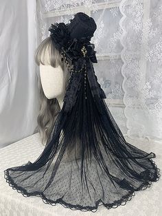 Complete your Gothic Lolita or Kawaii look with this stunning cross chains gothic black floral design mini hat with veil. Adorned with gorgeous bowknots, this mini hat is the perfect accessory to add a touch of elegance and mystery to your outfit. The black floral design adds a hint of darkness, while the veil brings an air of sophistication. This mini hat is a standalone piece that will instantly elevate your style, whether you're dressing up for a special event or adding a unique touch to your Hat With Veil, Victorian Accessories, Veiled Hats, Victorian Hats, Veil Accessories, Mini Hat, Gothic Cross, Black Crown, Elegant Hats