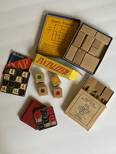 an assortment of wooden toys and games on a table