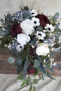 a bouquet of flowers sitting on top of a table