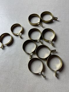 several pairs of metal rings sitting on top of a table