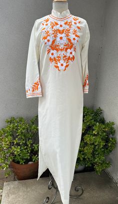 "Vintage boho white orange kaftan dress floral embroidered Sz small. Good condition with no label, polyester sheer fabric. Angel sleeves and back zipper plus side slits  Measurements  Shoulders 15\" Sleeves 21\" Bust waist 38\" Hips 42\" Length 55\"" White Embroidered V-neck Kurta, White V-neck Dress With Resham Embroidery, Off White Floral Embroidered Kurta For Spring, White V-neck Kaftan For Spring, Spring Orange Straight Kurta, Bohemian Off White Kurta With Floral Embroidery, White V-neck Floral Print Kaftan, White Kaftan With Chikankari Embroidery, White V-neck Embroidered Dress For Festival