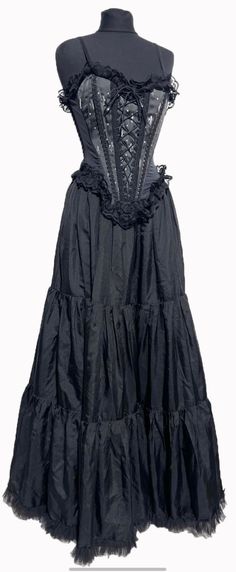 H6/2 #RC23N  RS50/C9-3 This is beautifully made  gothic outfit with boned Corset is black/silver fleur-de woven satin heavy brocade with Front Corseted and spaghetti straps ,it has Sides black Lycra Panels and back zip up. Boned Corset is Available in 3 Sizes S/34"M/36"L/38"Bust. black satin fabric layer/tiered very wide flared satin Skirt is fully  lined ,hangs well when worn.  with sides elasticated  with stretch to fit waist size 34" and without stretch waist 28" Skirt is one size and can fit Gothic Black Corset Dress For Costume, Black Gothic Corset Dress For Costume, Black Gothic Corset For Costumes, Steampunk Black Corset Dress For Costume, Gothic Corset Dress With Corset Back, Gothic Overbust Corset Dress With Boned Bodice, Gothic Overbust Corset Dress With Corset Back, Gothic Overbust Corset Dress For Alternative Fashion, Gothic Black Overbust Corset Dress