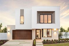 a white two story house with brown garage doors on the front and side windows at dusk